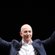 Amazon CEO Jeff Bezos holds up two Kindles at a press conference in 2012. The ebook reader was originally released in 2007.
